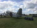 Moto tug with c-47 on tow